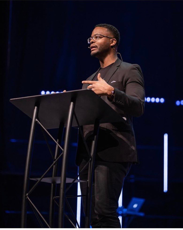 BJ Thompson speaking on stage